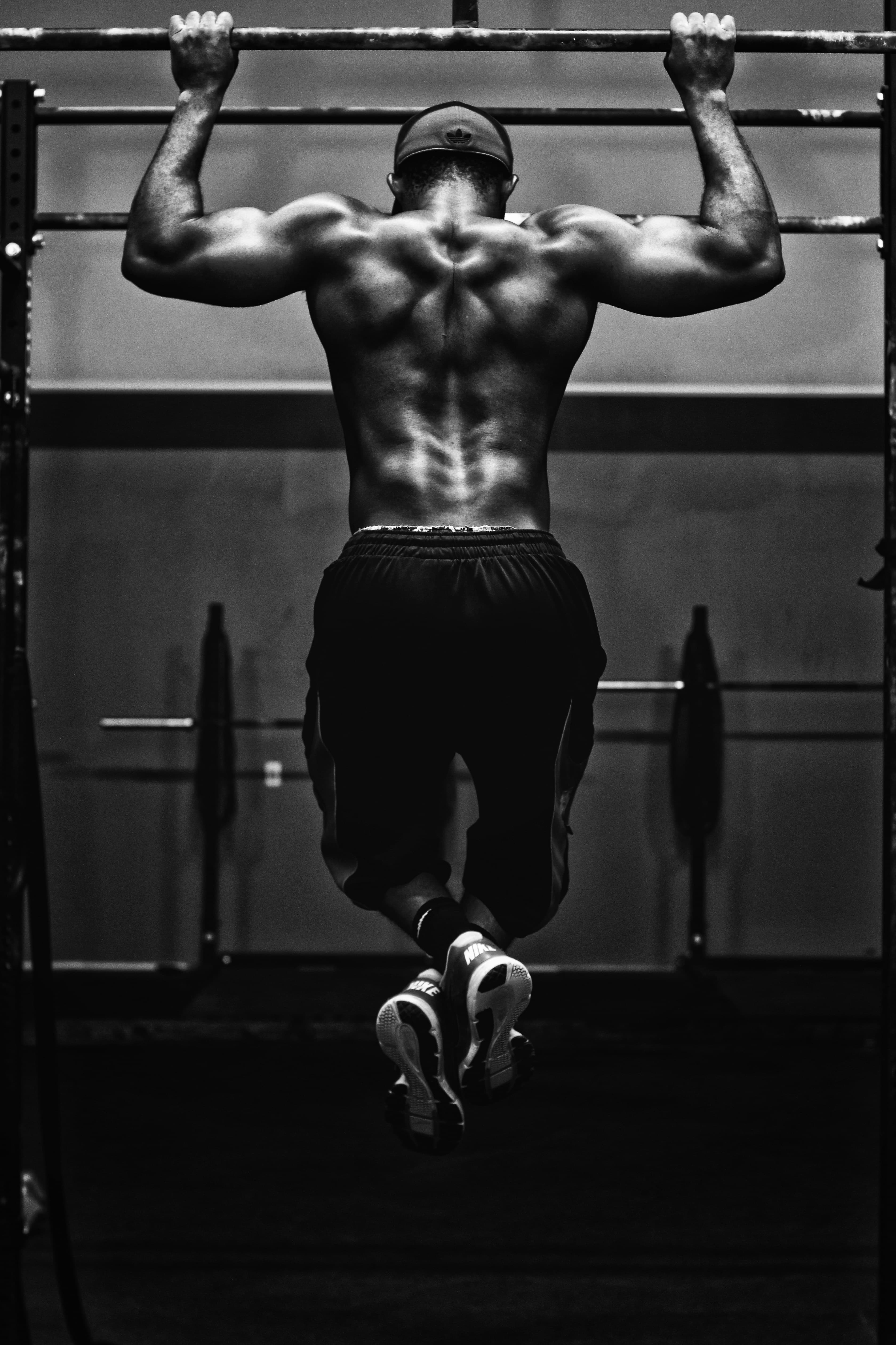 Grayscale photo of a man working out