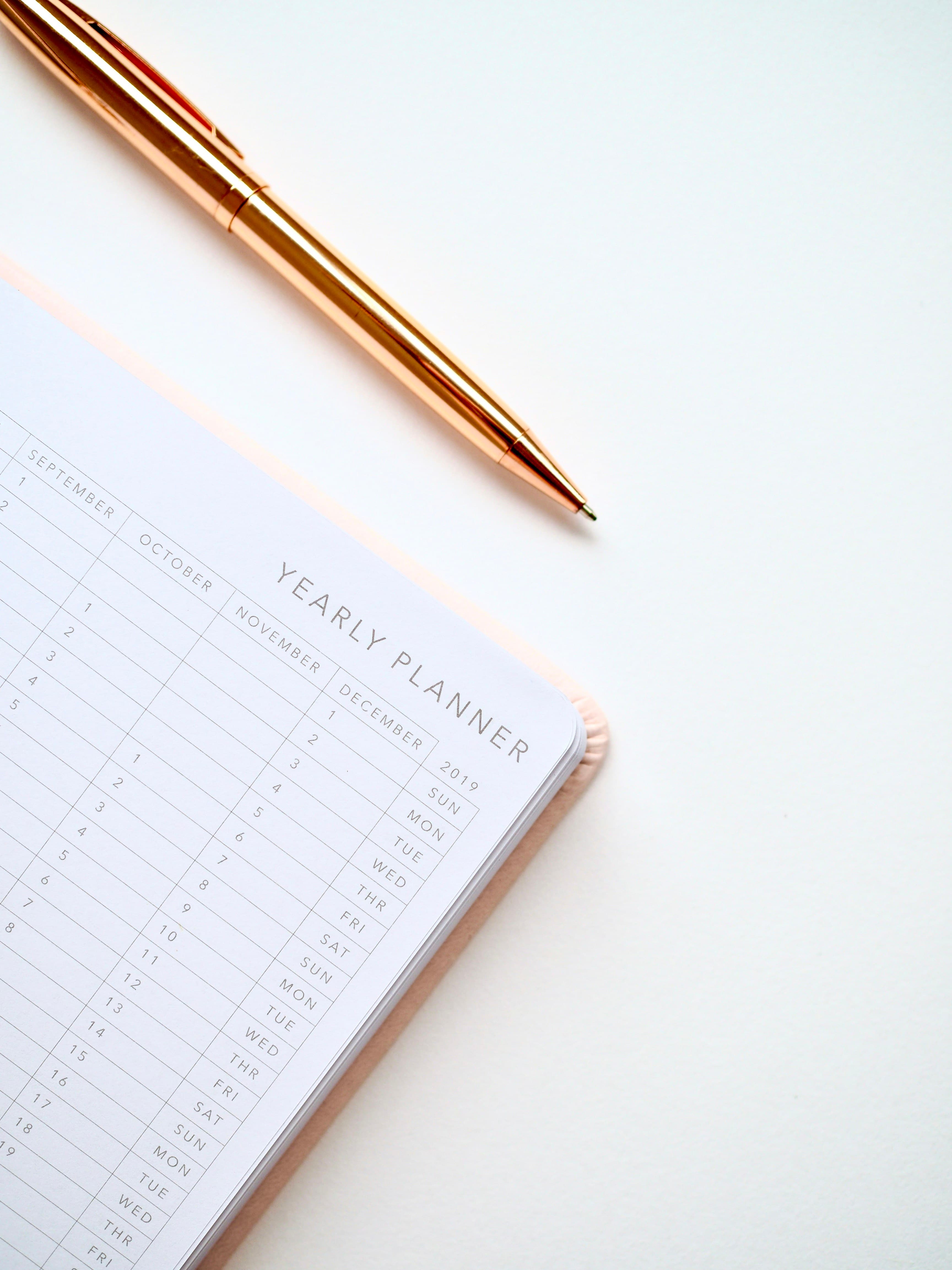 A yearly planner notebook on a desk