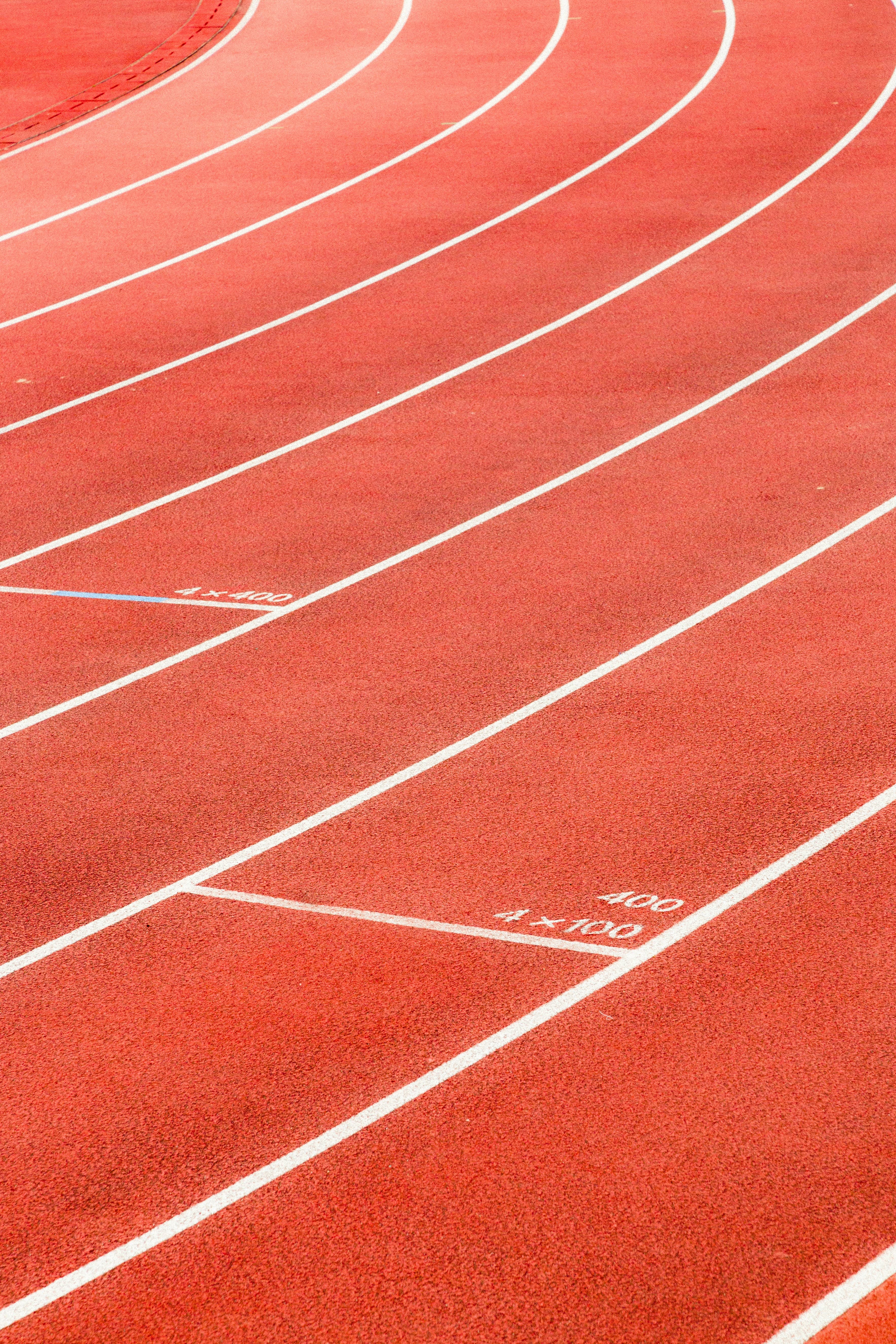 Red running track lane markings