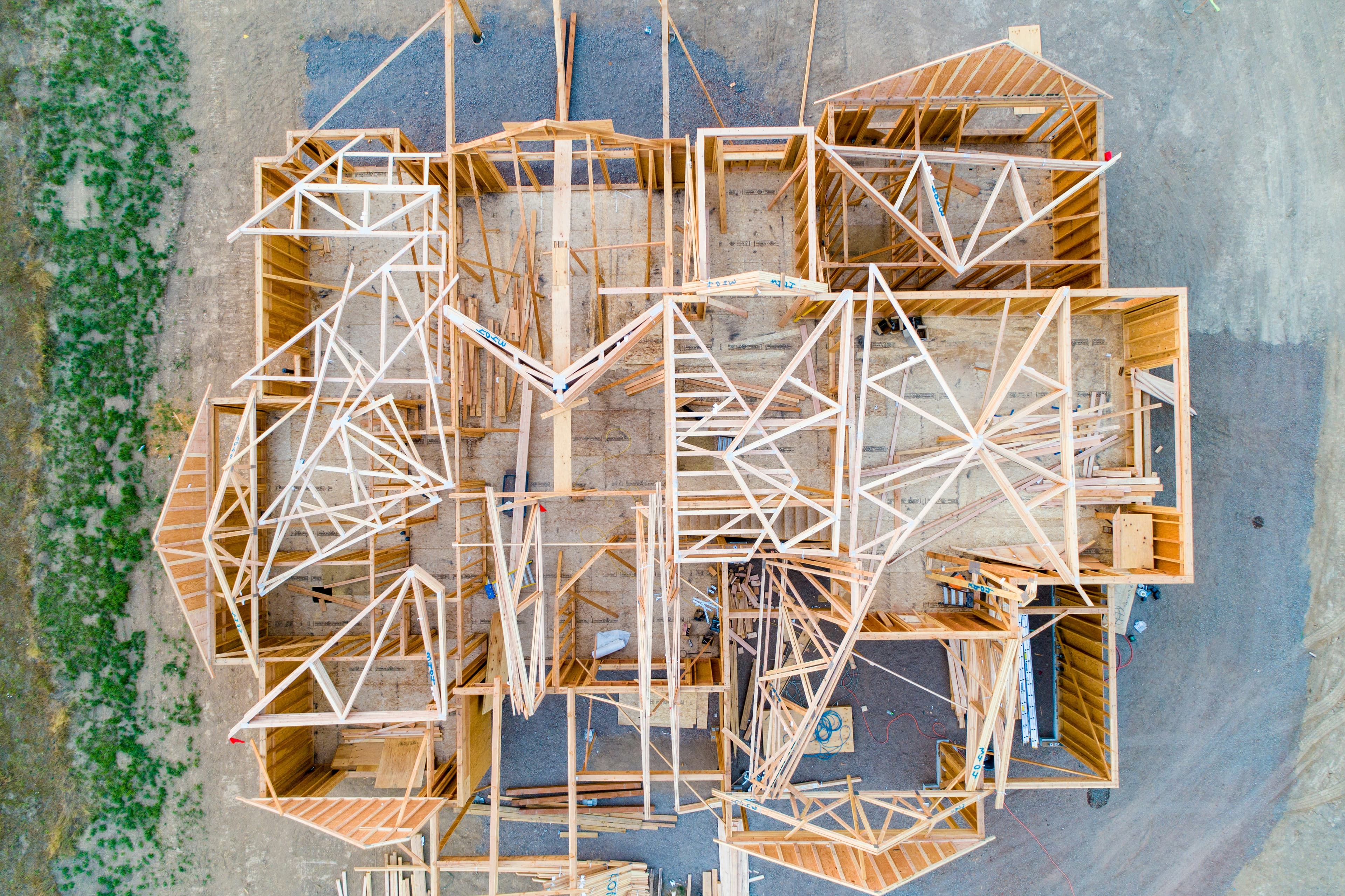 A beige wooden architectural model of a house layout