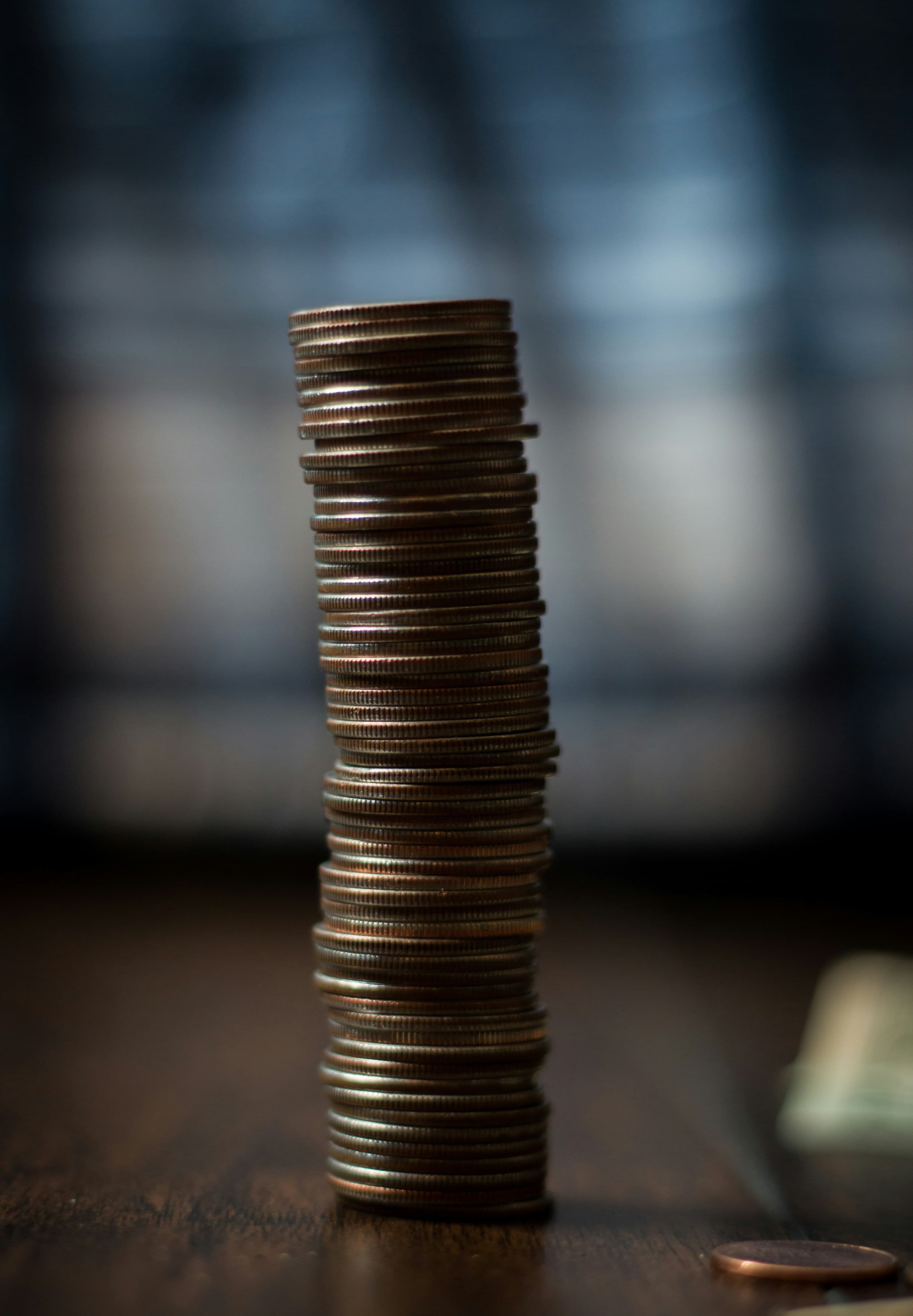 Gold coins on a brown wooden table