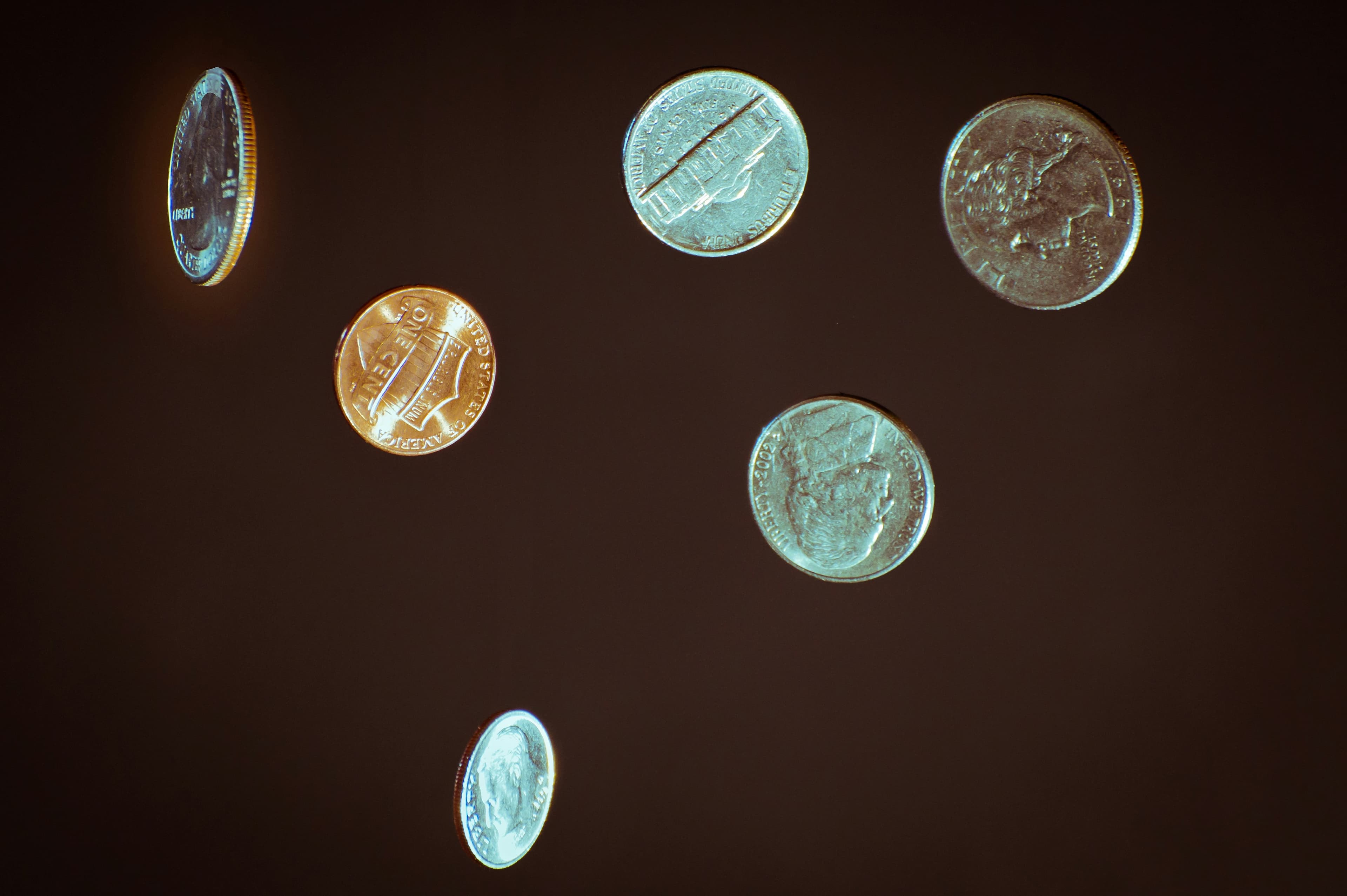 Silver coins on a white surface