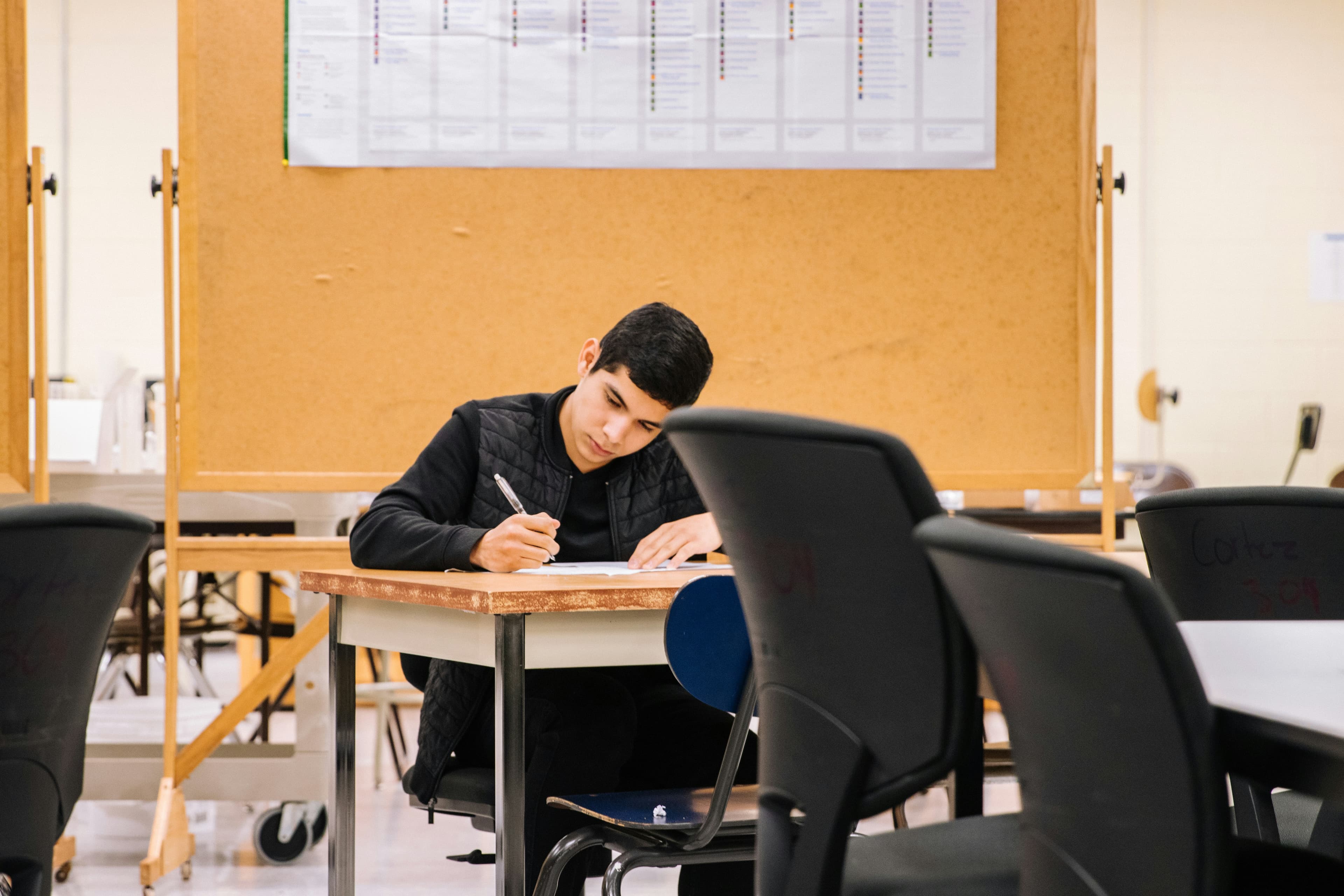 A student sitting at a desk studying