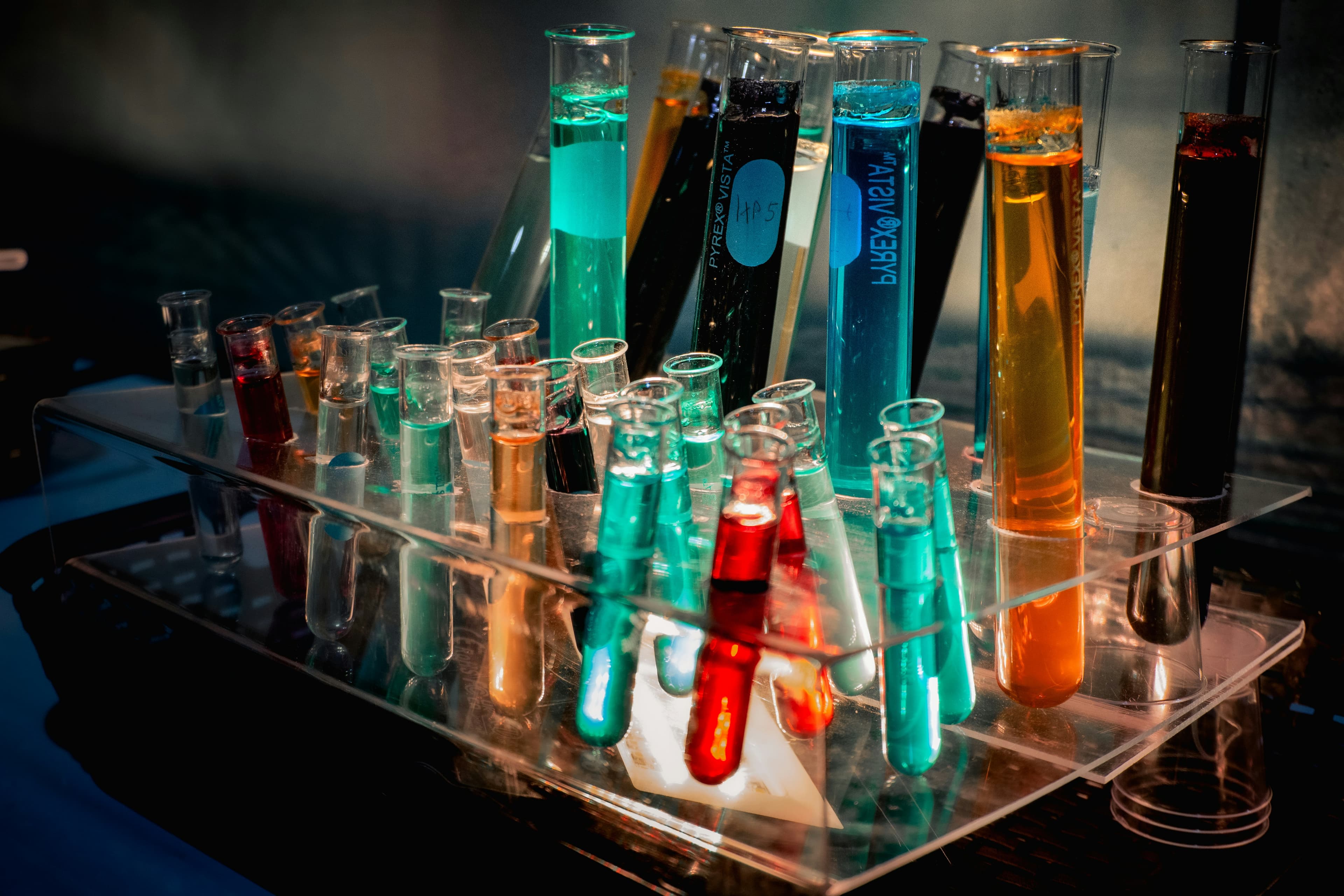 Test tubes filled with different colored liquids