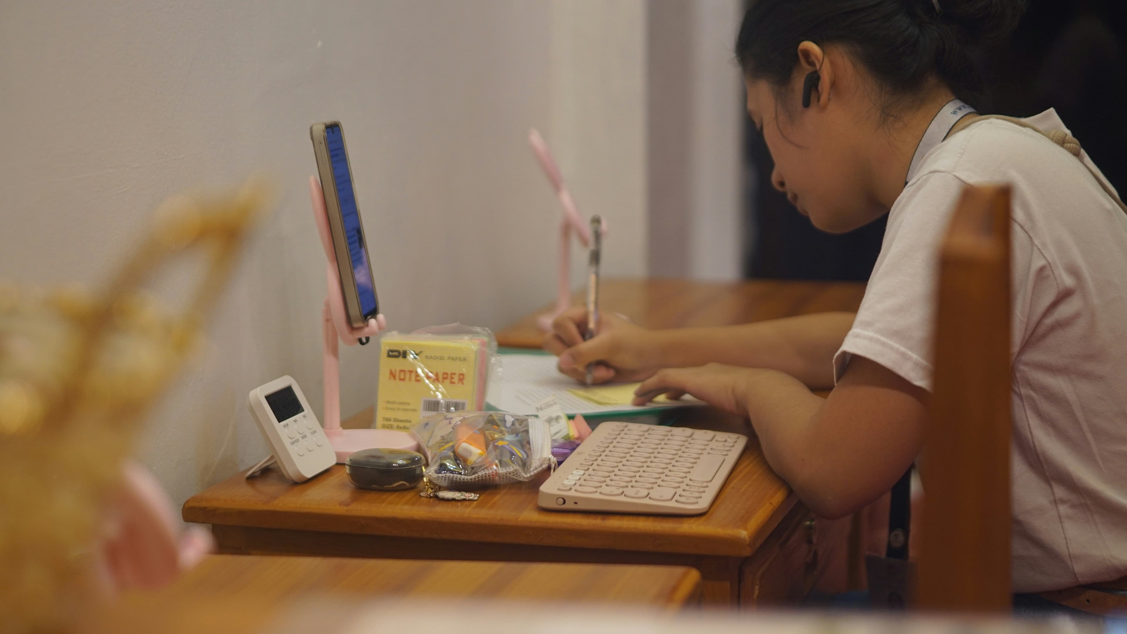 A person sitting at a desk working on a computer
